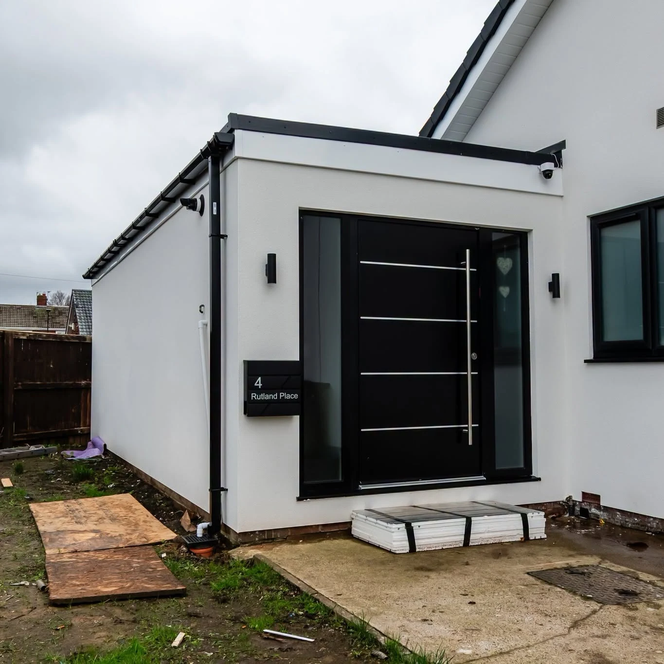 Rendered frontage with a new entrance porch and pivot door, Washington