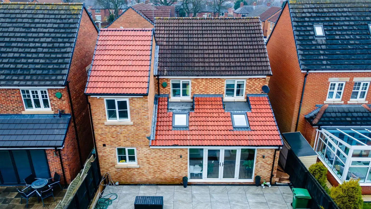 Rear extension with red tiled roof and velux rooflights from above, South Shields