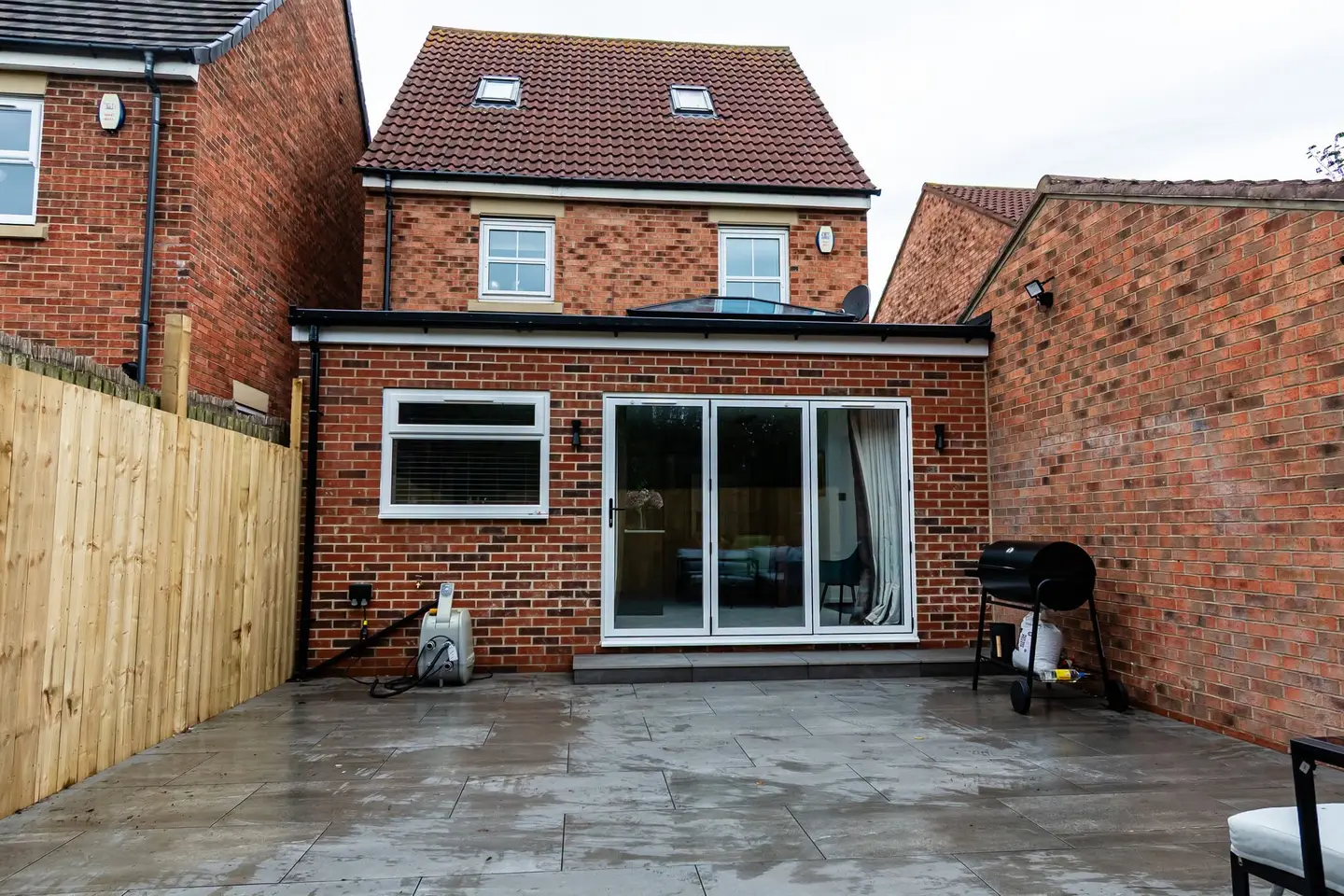 Rear extension with bifold doors onto a new patio, Shiremoor
