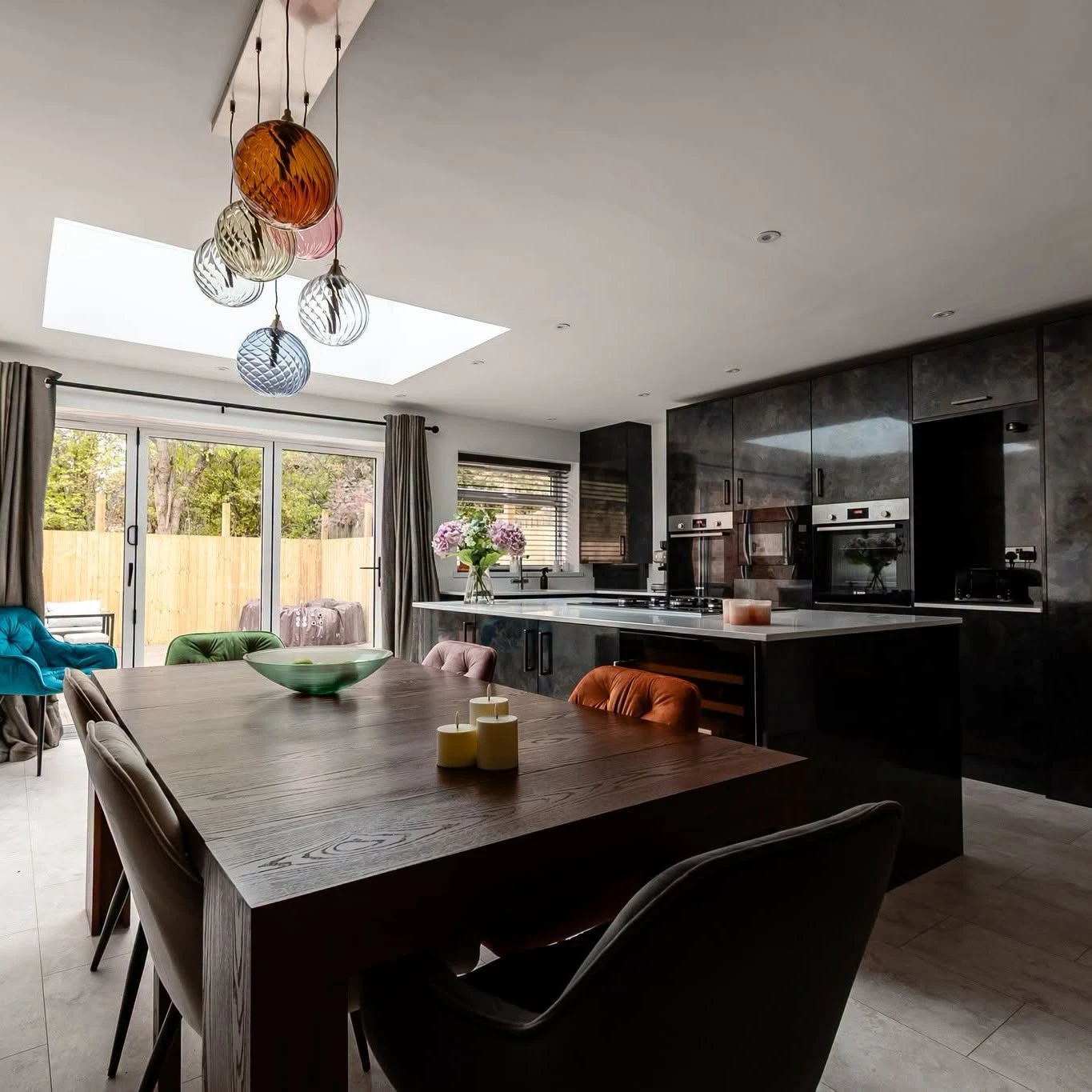 Dark gloss kitchen with island under a roof lantern, Shiremoor