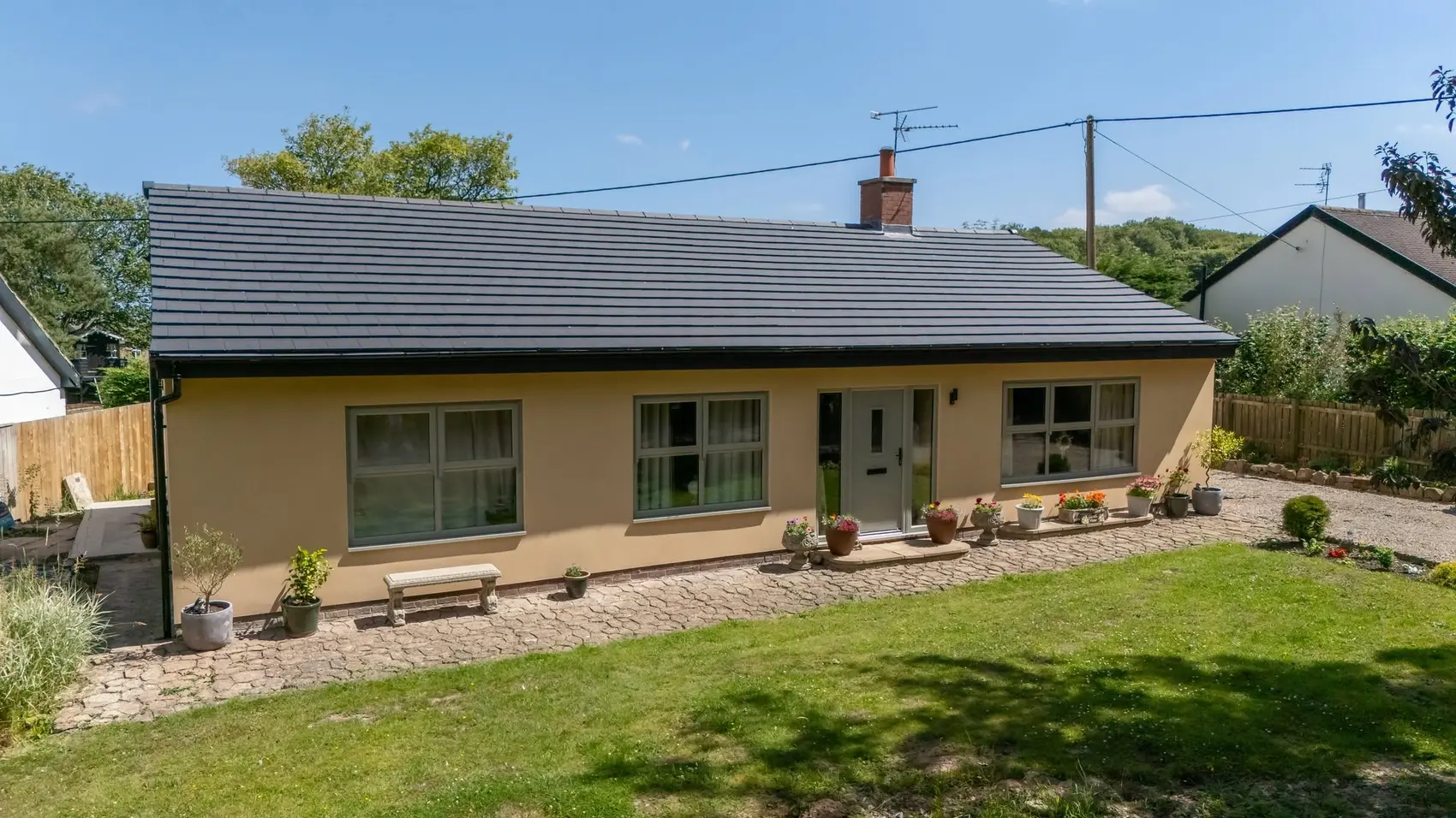 Rendered bungalow with a new tiled roof after a full renovation, Cresswell
