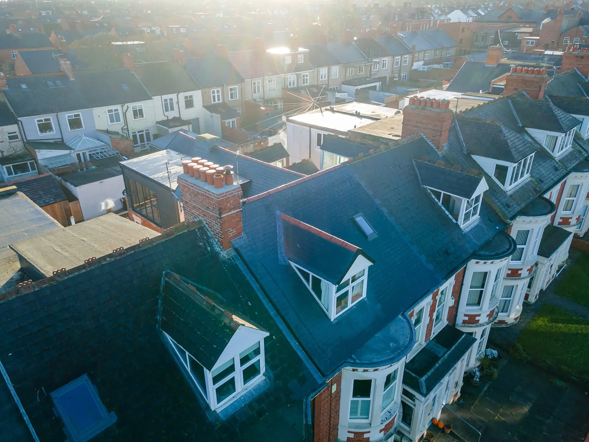 Aerial view of a terrace with new slate roof and dormers after a loft conversion, Whitley Bay
