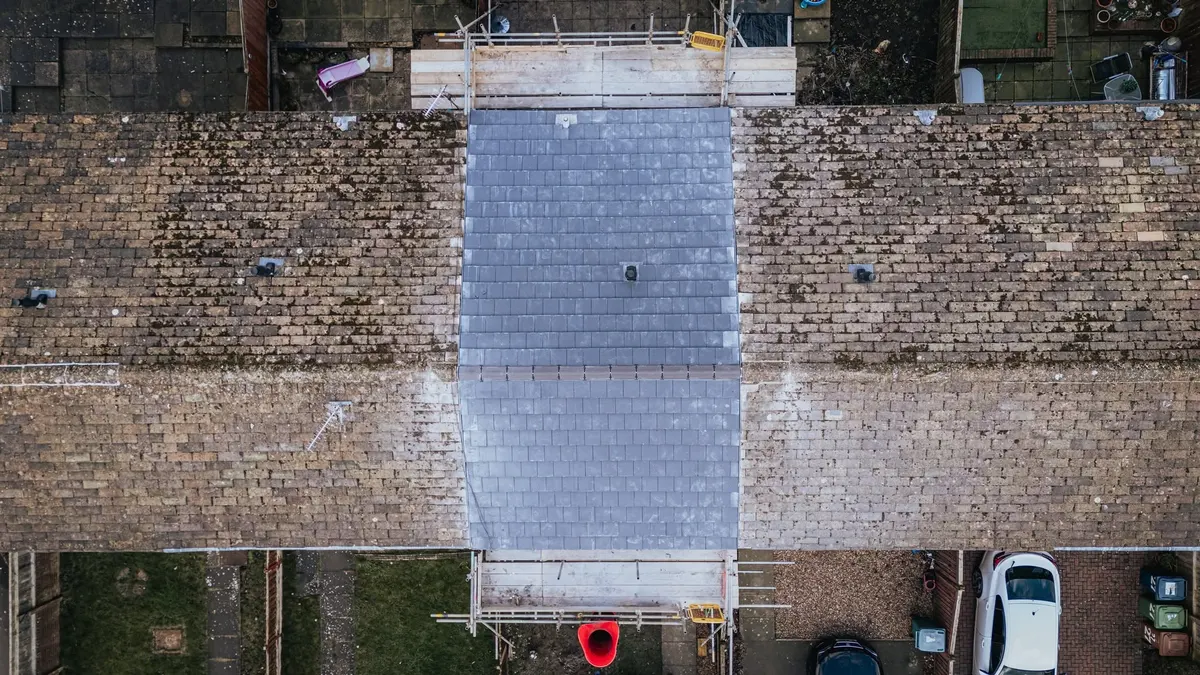 Top-down aerial view of a terrace with a new slate roof, Hebburn